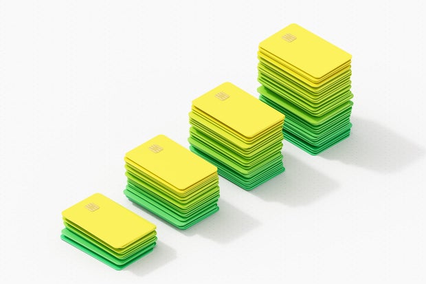 Digitally generated image of isometric coloured credit cards. Growth bar chart 