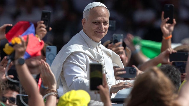 Pope Leo XIV waves as he leaves at the end of Mass for the Jubilee of Youth in Tor Vergata 