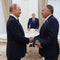 In this pool photograph distributed by the Russian state agency Sputnik, Russia's President Vladimir Putin greets U.S. special envoy Steve Witkoff prior to their talks in Moscow on Aug. 6, 2025. 