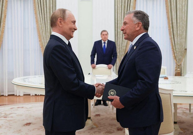 In this pool photograph distributed by the Russian state agency Sputnik, Russia's President Vladimir Putin greets U.S. special envoy Steve Witkoff prior to their talks in Moscow on Aug. 6, 2025. 