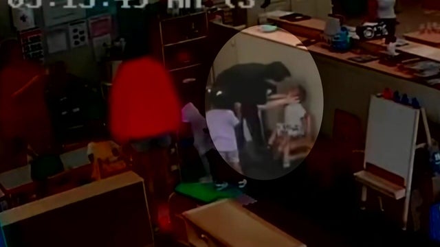 A day care employee grabs a child's neck and face. 