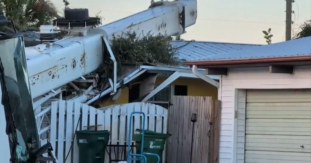Crane tips over onto Florida home