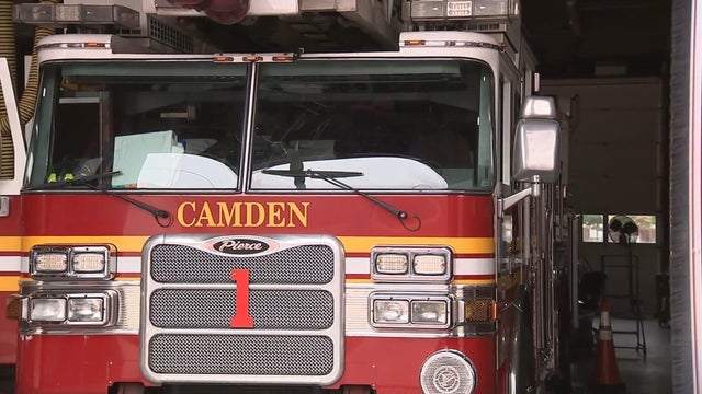 A Camden fire truck pulls out of a station garage 
