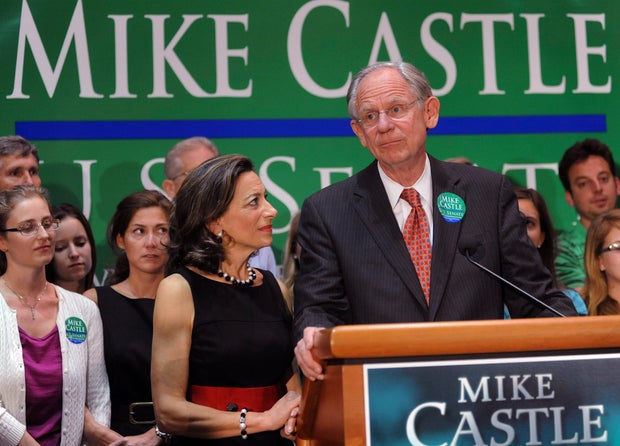 In this Sept. 14, 2010, file photo Delaware Republican Senate candidate, Rep. Mike Castle, R-Del., joined by his wife Jane, center, addresses supporters after his defeat on primary election night in Wilmington, Delaware