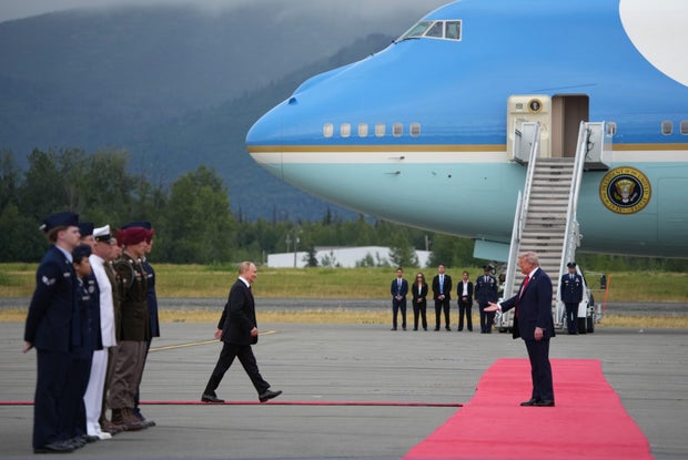 President Trump greets Russian President Vladimir Putin 