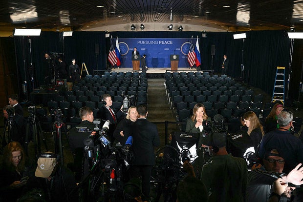 Members of the media set up their cameras ahead of the summit between President Trump and Russian President Vladimir Putin at Joint Base Elmendorf-Richardson in Anchorage, Alaska, on Aug. 15, 2025. 