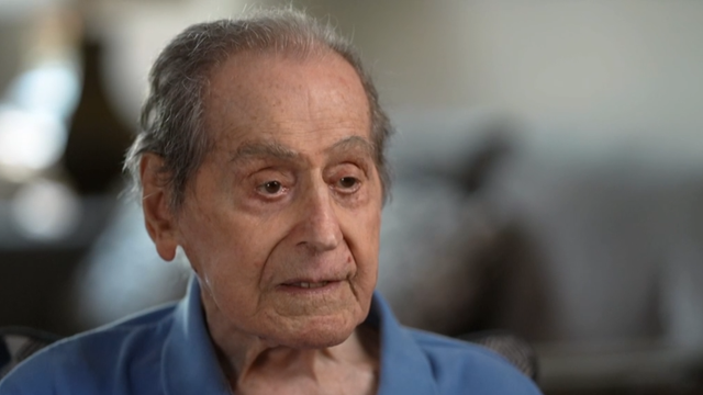 WWII veteran fulfills decades-old contract, conducts band on his 100th birthday 