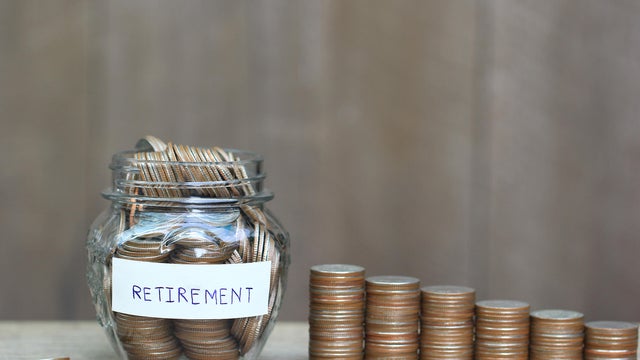 Finance, Model house on Stack of coins money on natural green background, Save money for prepare in future and retirement concept. 