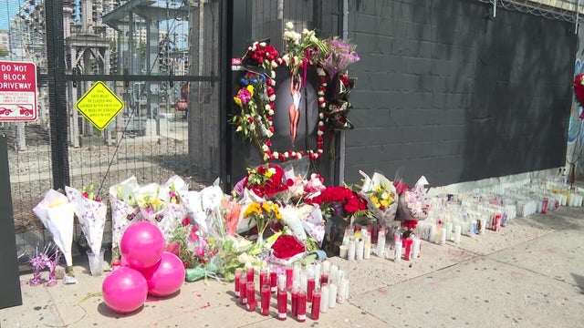 Flowers, candles and a photo of Ariela Mejia-Polanco 
