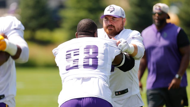 Minnesota Vikings defensive tackle Harrison Phillips, right, and nose tackle Javon Hargrave work on a drill during the team's NFL football training camp Saturday, July 26, 2025, in Eagan, Minn. 