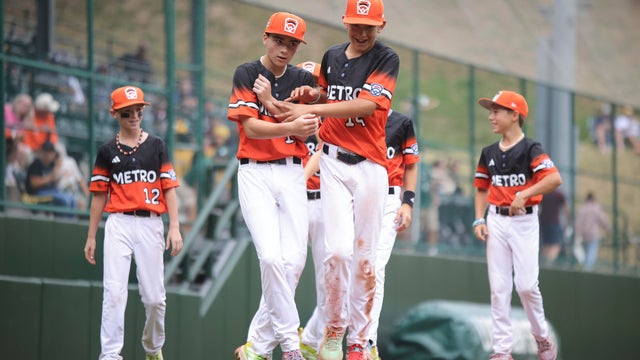 Las Vegas' Brooks Fechser (4) scores as Fairfield, Conn.'s Luca Pellegrini covers home on a wild pitch during the first inning of the United States Championship baseball game at the Little League World Series tournament in South Williamsport, Pa., Saturday, Aug. 23, 2025. 