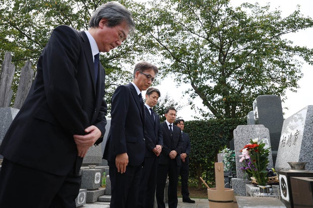 Police express regret at grave of Jap businessman who was once wrongfully arrested and died after lengthy detention