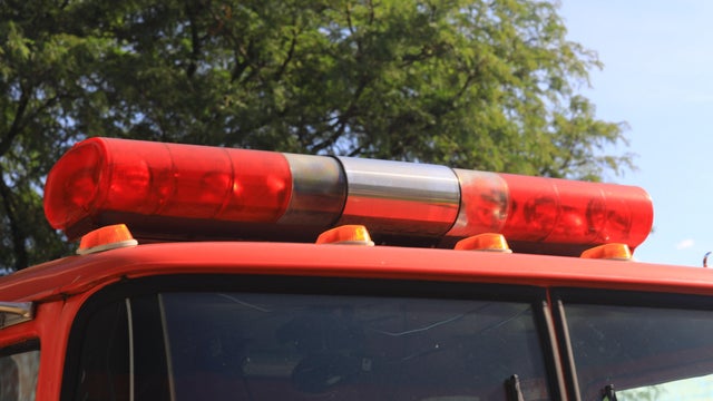 Overhead siren and flashing red lights on a fire truck 