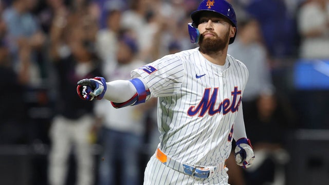 New York Mets' Brandon Nimmo reacts after hitting a walk-off single leading Starling Marte to score during the ninth inning of a baseball game against the Philadelphia Phillies, Tuesday, Aug. 26, 2025, in New York. 