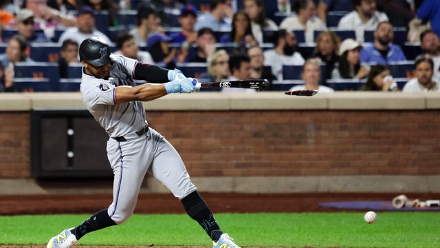 Otto Lopez #6 of the Miami Marlins breaks his bat in the seventh inning against the Miami Marlins at Citi Field on August 28, 2025 in New York City. 