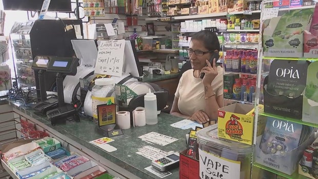 Shital Patel answers the phone at her store