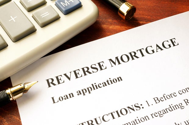 Reverse mortgage loan application on a table. 
