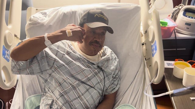 David Williams lays in a hospital bed 