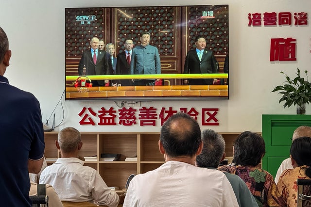 Elderly Residents Watch Victory Day Parade Broadcast In Chongqing 