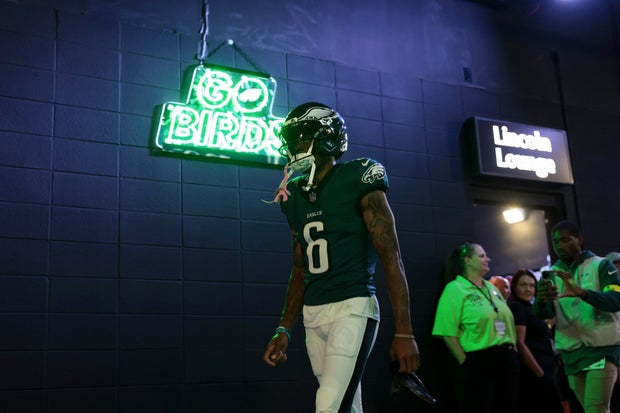 The neon Go Birds sign is seen as DeVonta Smith of the Philadelphia Eagles walks through the tunnel before the Cowboys game 