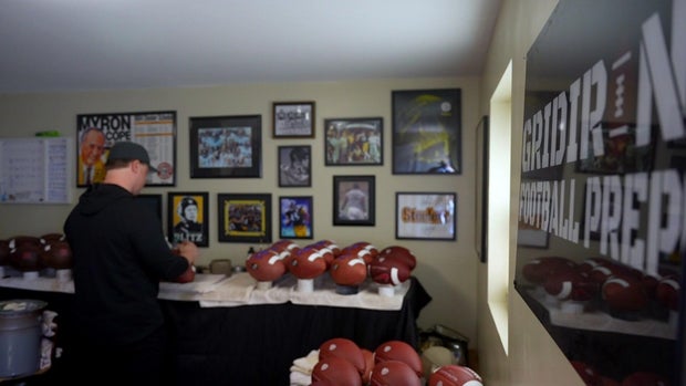 Dan Kolcun working on footballs in his garage 
