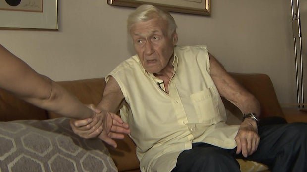 Lawrence Schwartz demonstrates how he twisted the arm of a woman who allegedly tried to steal his Rolex. 