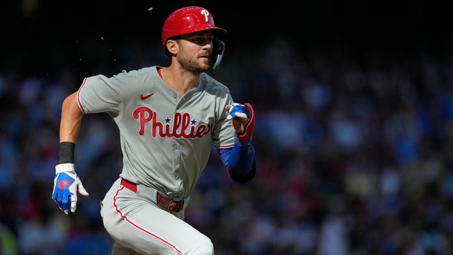 Trea Turner runs toward first base in a game in Milwaukee 