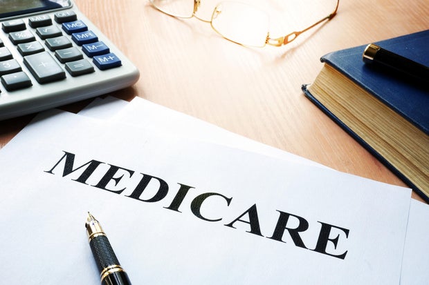 Medicare policy on a desk.