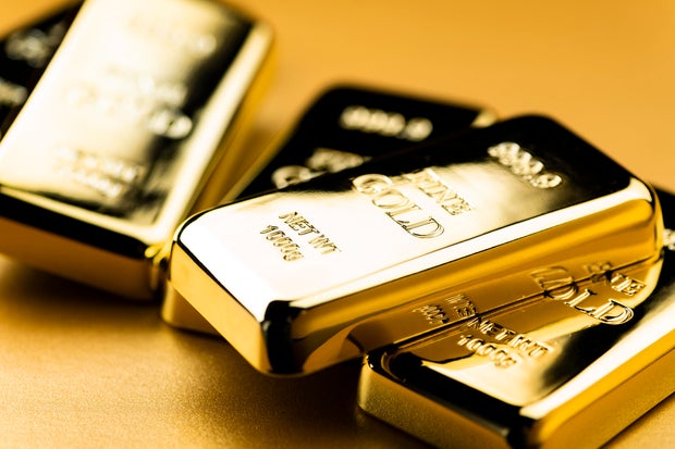 Image of Gold Ingots on Golden Background 