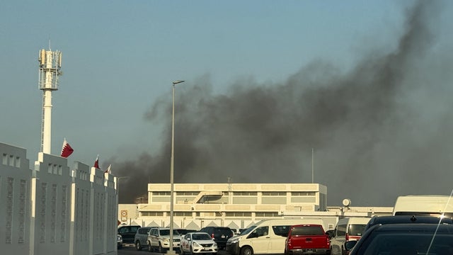 Smoke rises after several blasts were heard in Doha 