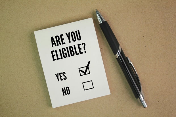 Pen and paper with question word Are you eligible? the concept of choice. choose yes 