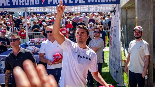 Conservative activist Charlie Kirk throws hats to the crowd shortly before he was shot at a Utah Valley University speaking event in Orem, Utah, Sept. 10, 2025. 