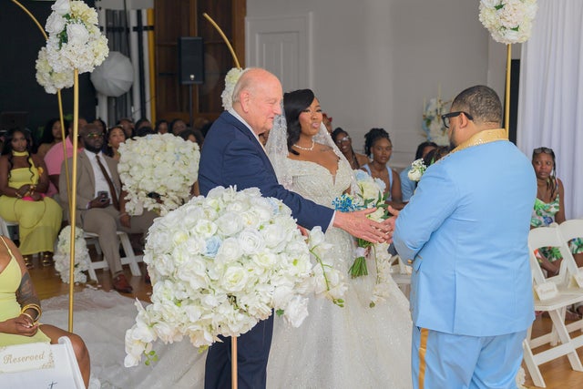 Gil Pulliam walks Shacole Fox down the aisle at her wedding 