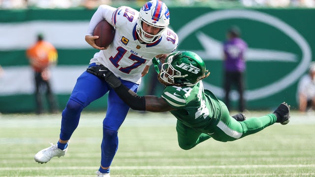 Jamien Sherwood #44 of the New York Jets attempts to tackle Josh Allen #17 of the Buffalo Bills during the third quarter at MetLife Stadium on September 14, 2025 in East Rutherford, New Jersey. 