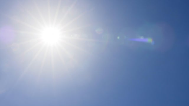 Full bright sun in the blue sky 