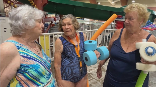 Joann Arnold speaks to two other women near the pool