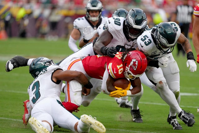 Kansas City Chiefs running back Isiah Pacheco is tackled by Philadelphia Eagles' Nolan Smith, Jordan Davis and Zack Baun 