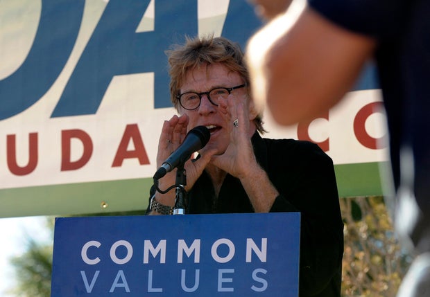 (JS) REDFORDVOTE31-- Robert Redford spoke on the behalf of Barack Obama and Mark Udall during an early vote rally outside the Municipal Center in Aurora. RJ Sangosti/ The Denver Post 