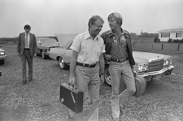 Jimmy Carter Carries Redford's Briefcase