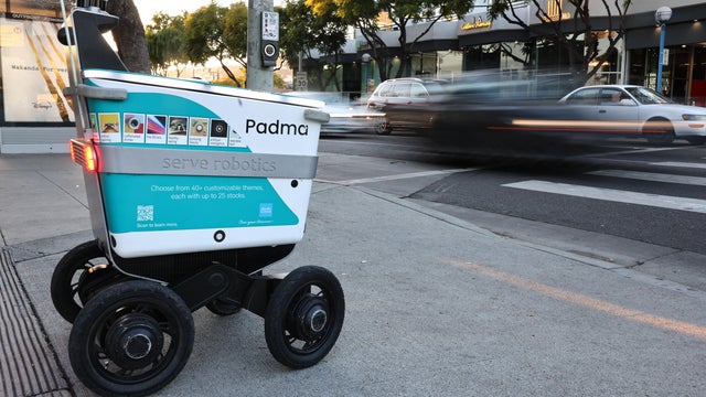 Pedestrians Share The Streets With Food Delivery Robots In Parts Of Los Angeles 