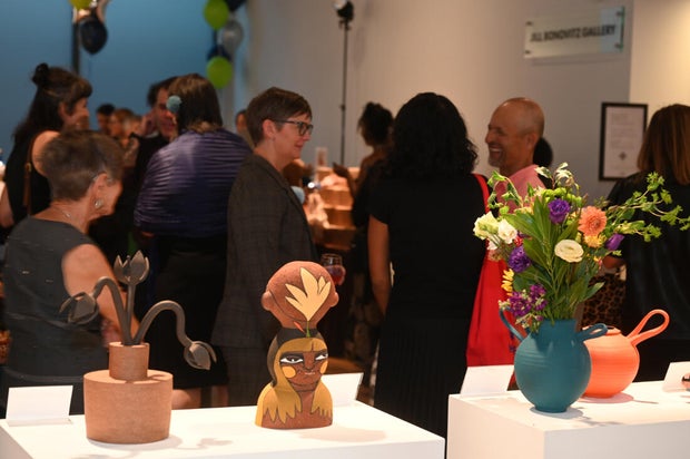 People pose for photos at Mud Ball 2025