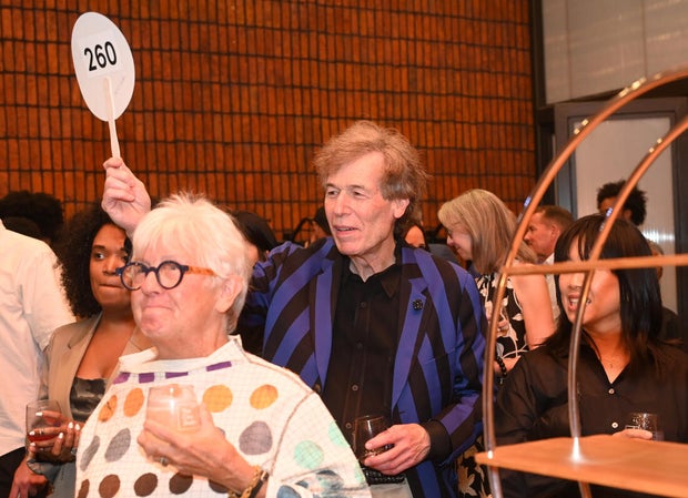People pose for photos at Mud Ball 2025