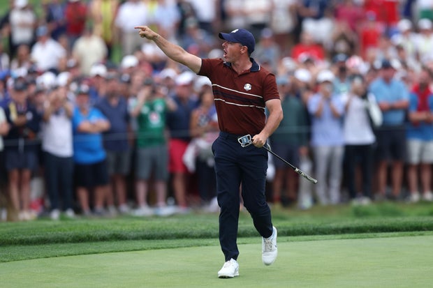 Rory McIlroy of Team Europe yells to the crowd as he walks off the 17th hole green during the Saturday afternoon four-balls matches of the 2025 Ryder Cup at Black Course at Bethpage State Park Golf Course on September 27, 2025 in Farmingdale, New York. 