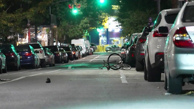 A bike lying in a street in Brooklyn. 