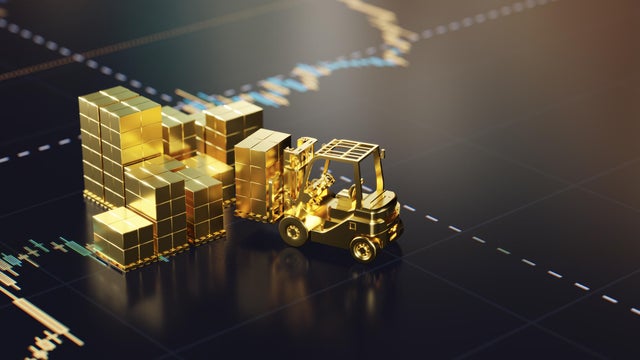 Golden Forklift Operating Among Stacks of Gold Bars on Market Graph Background 