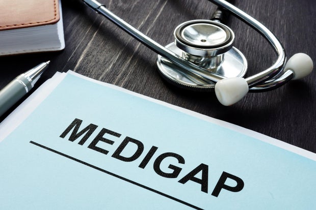 Supplement Health Insurance papers and stethoscope. 