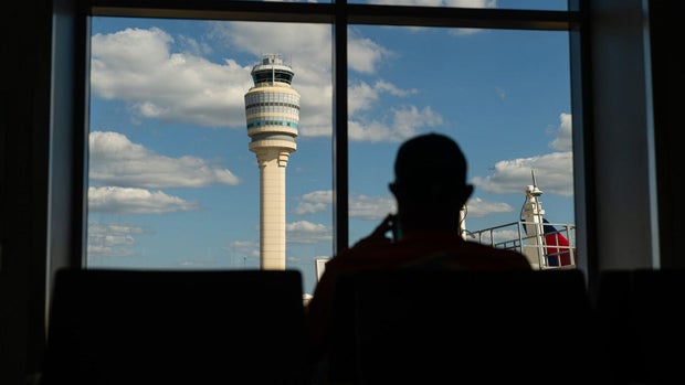 Travelers At HartsfieldJackson Atlanta International Airport As Congress Averts FAA Lapse With Stopgap Passage