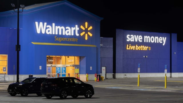 The front of a Walmart Superstore is pictured at night. 