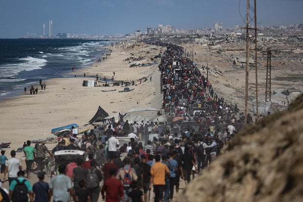 Palestinians return home after ceasefire takes effect in Gaza 