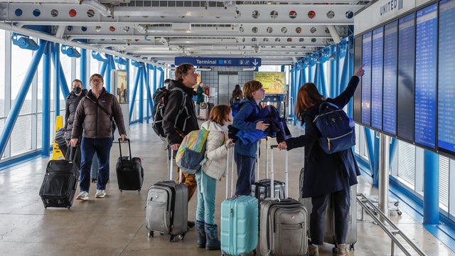 Winter road through snowy nature with blue sky in Lofoten Islands, Norway 